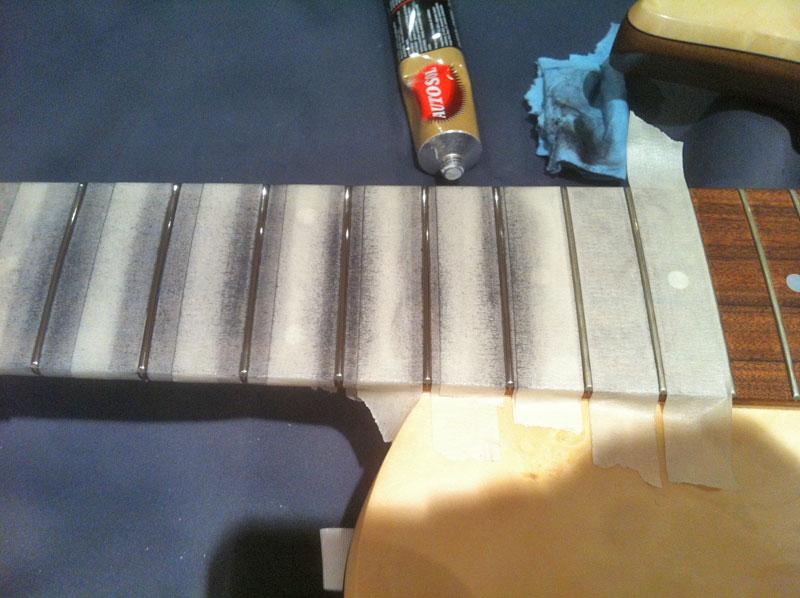 rubbing the fret with metal polish rubbing the fret with metal polish